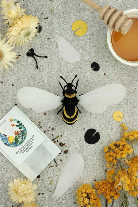 Gold satin paper craft of a honey bee made from Assembli Paper Honey Bee craft paper, showcasing detailed bee and wings.