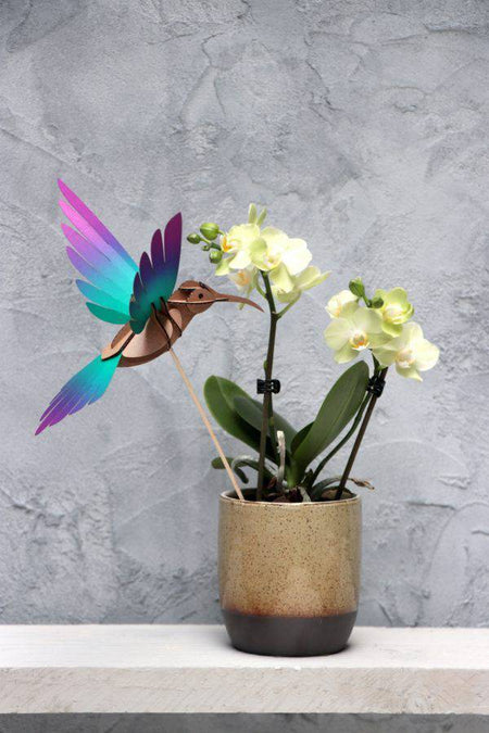 Yellow and blue paper crafts featuring a colorful paper colibri bird made from Assembli Paper Colibri crafts.
