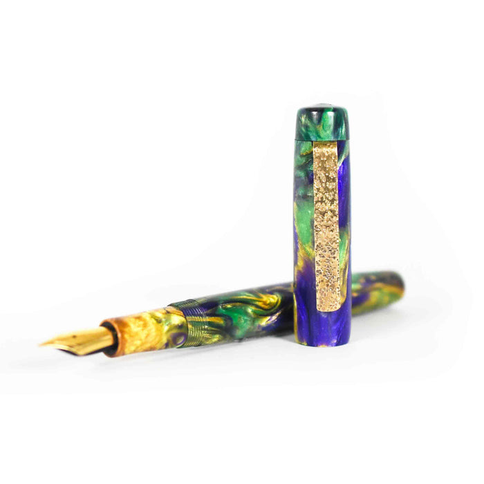 Papier Plume x Hardy Penwrights Krewe of Calliope fountain pen with gold clip and black resin body, showcasing elegant craftsmanship.