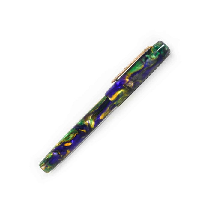 Papier Plume x Hardy Penwrights Krewe of Calliope fountain pen with gold accents and textured grip, showcasing its elegant design.