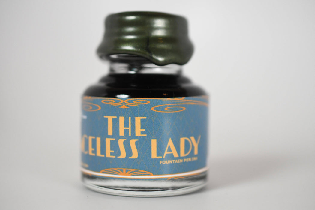 Papier Plume Chicago Pen Show The Faceless Lady Shimmer Fountain Pen Ink bottle with label and shimmering ink inside.