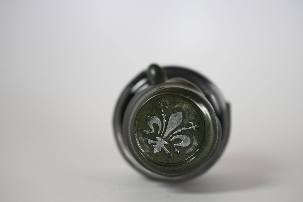 Papier Plume Chicago Pen Show The Faceless Lady shimmer fountain pen ink bottle with decorative label and shimmering ink inside.