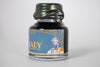 Papier Plume Chicago Pen Show Faceless Lady Shimmer Fountain Pen Ink bottle with label and shimmering ink in a glass container.