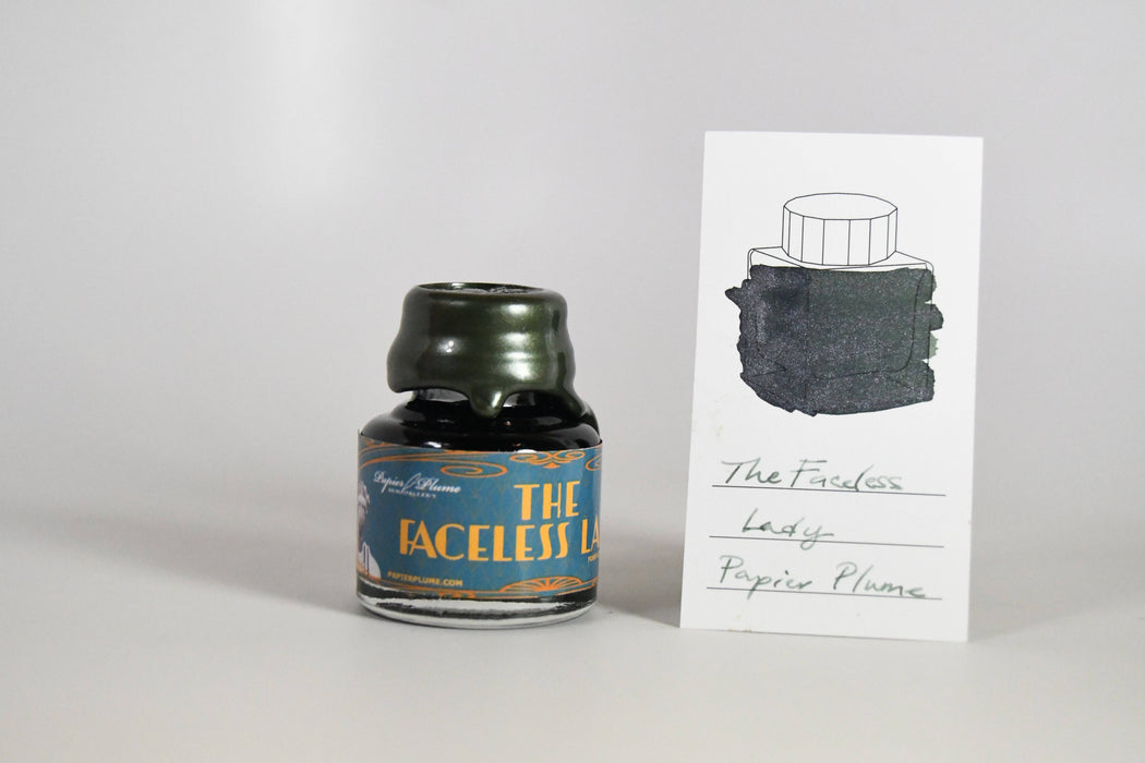 Papier Plume Chicago Pen Show Faceless Lady Shimmer Fountain Pen Ink bottle with colorful label and shimmering ink details.