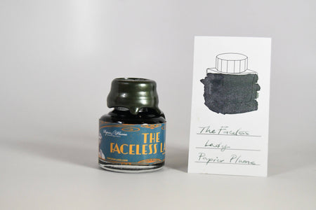 Papier Plume Chicago Pen Show Faceless Lady Shimmer Fountain Pen Ink bottle with colorful label and shimmering ink details.