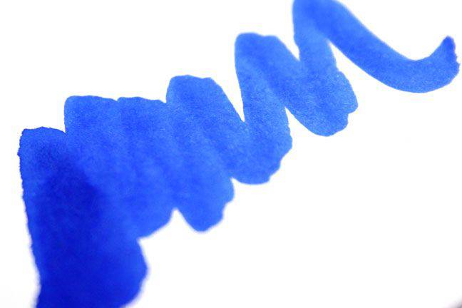 Papier Plume New Orleans Collection fountain pen ink in Calle Real bottle, vibrant ink visible in glass ink bottle.