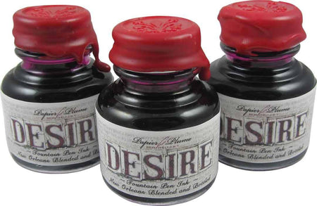 Papier Plume New Orleans Collection Desire fountain pen ink bottle with elegant label and ink inside, ideal for writing and calligraphy.