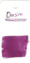 Papier Plume New Orleans Collection fountain pen ink bottle labeled Desire, showcasing elegant packaging and dark ink inside.