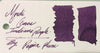 Papier Plume New Orleans Collection fountain pen ink in vibrant Mardi Gras Indians purple, shown in a glass ink bottle.
