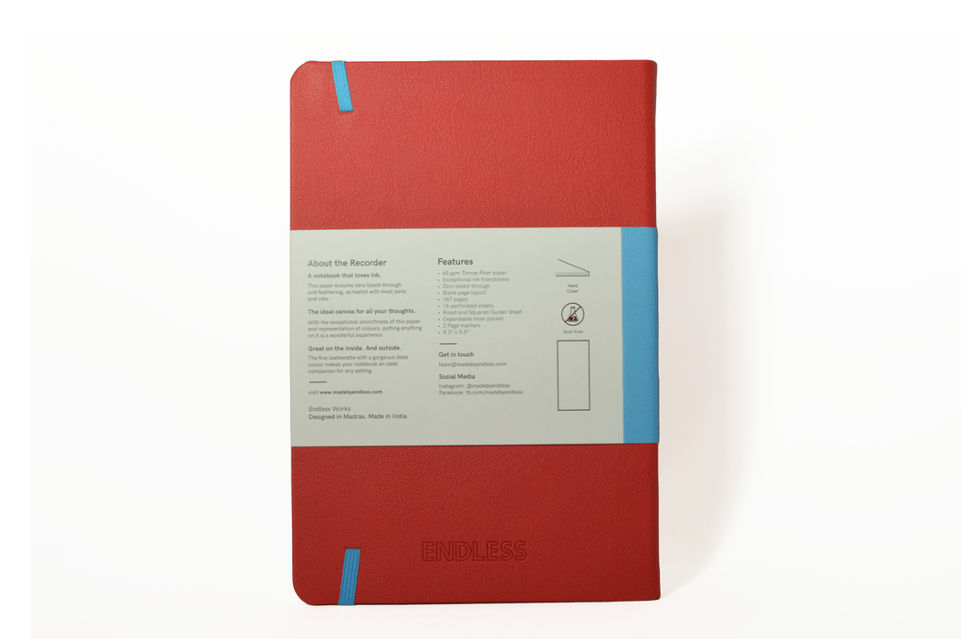 Endless Recorder journal with crimson sky cover, blank pages, and spiral binding, ideal for note-taking and writing.