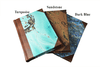 Handcrafted Il Cartiglio leather-trimmed journal with marbled paper and modern spine, featuring lined pages and turquoise cover.