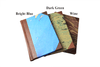 Handcrafted leather-trimmed journal with marbled paper pages and modern spine by Il Cartiglio. Small lined turquoise journal.