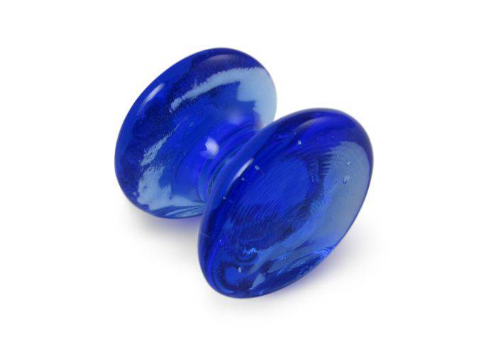 Amber glass pen rest by Papier Plume with a smooth, curved design for holding pens and writing tools.