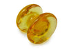 Amber glass pen rest by Papier Plume, smooth curved design, perfect for holding pens and writing accessories.