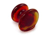Amber glass pen rest by Papier Plume, elegant and smooth, designed to hold pens securely on a desk or workspace.