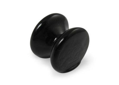 Amber glass pen rest by Papier Plume, elegant and smooth with a sleek design for holding pens on a desk.