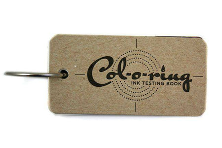 Col-O-Ring Ink Testing Book showing pages with ink samples and testing sections for evaluating ink color and quality.