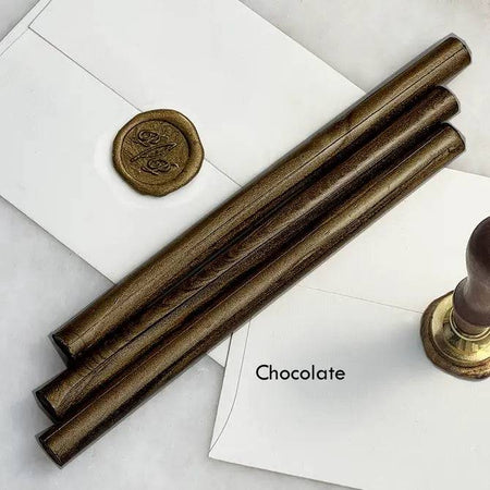Black pliable sealing wax sticks by Papier Plume, 7 inches long, used for sealing and decorative craft projects.