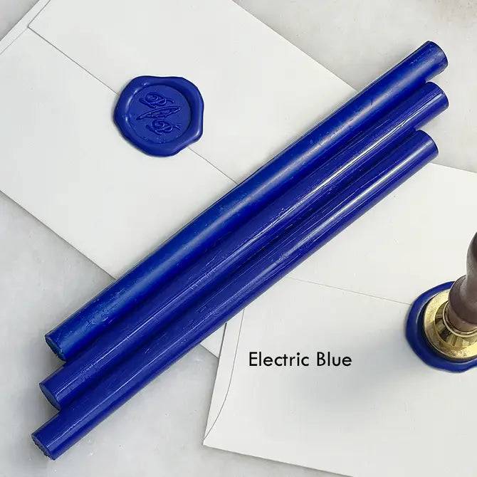 Black pliable sealing wax sticks by Papier Plume, 7 inches long, ideal for sealing letters and vintage-style crafts.
