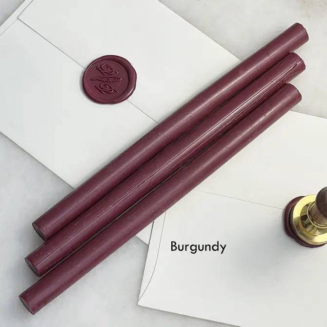 Black pliable sealing wax sticks by Papier Plume, 7 inches long, ideal for sealing and decorative wax applications.