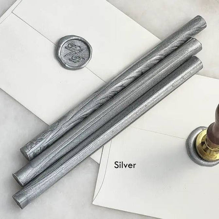 Black pliable sealing wax sticks by Papier Plume, 7 inches long, used for sealing and decorative wax sealing projects.