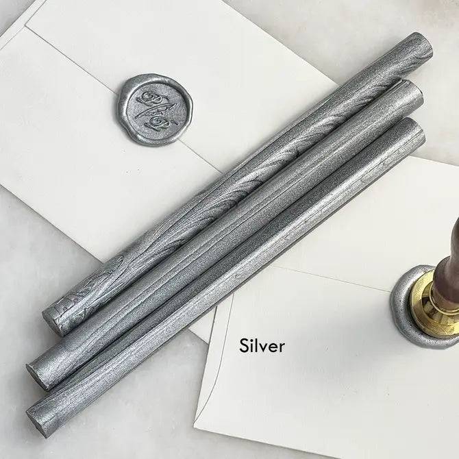 Black pliable sealing wax sticks by Papier Plume, 7 inches long, used for sealing and decorative wax sealing projects.