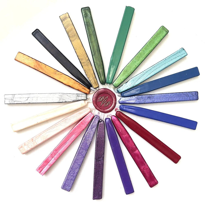 Set of Papier Plume sealing wax sticks with wicks in modern colors, ideal for sealing envelopes and adding decorative touches.