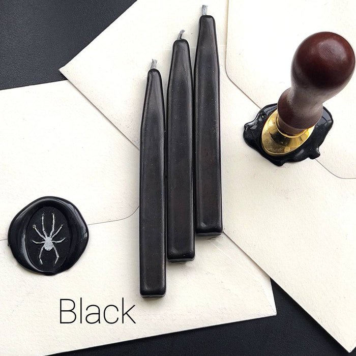 Papier Plume sealing wax sticks with wick in modern colors, featuring sleek, colorful wax for sealing and decorative purposes.