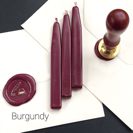 Papier Plume sealing wax sticks with wick in modern colors, showcasing vibrant wax in a close-up shot.