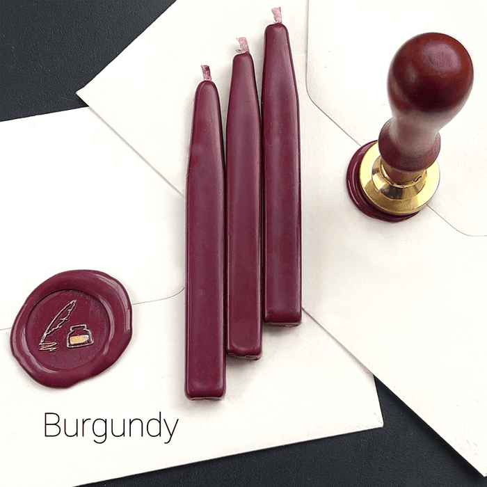 Papier Plume sealing wax sticks with wick in modern colors, showcasing vibrant wax in a close-up shot.