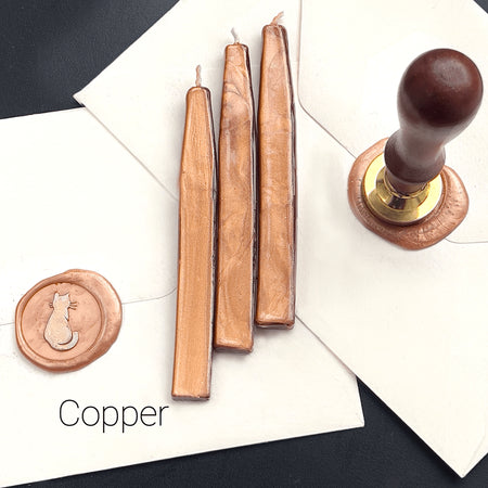Papier Plume sealing wax sticks with wick in modern colors, showing vibrant wax and wick for sealing and decorative purposes.