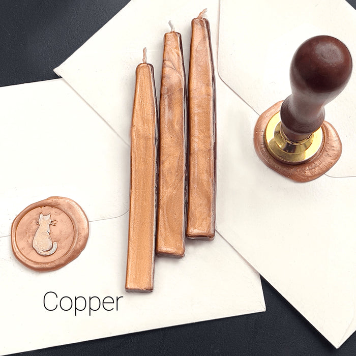 Papier Plume sealing wax sticks with wick in modern colors, showing vibrant wax and wick for sealing and decorative purposes.