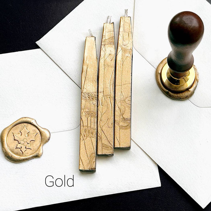 Set of Papier Plume sealing wax sticks with wicks in modern colors, ideal for sealing envelopes and adding a vintage touch.