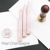 Papier Plume sealing wax sticks with wick in modern colors, used for sealing envelopes and adding decorative touches to letters.