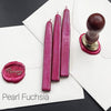 Papier Plume sealing wax sticks with wick in modern colors, showing vibrant wax and black sealing wax sticks for sealing letters.