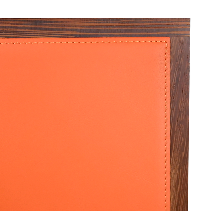 Orange Atelier De La Foret pen box holding eleven pens, with a sleek and compact design.