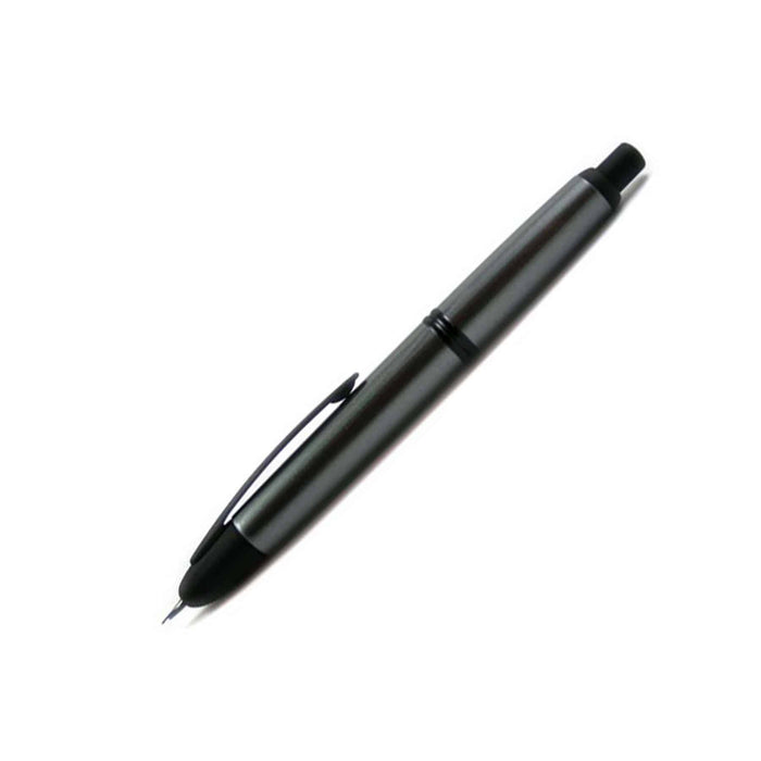 Pilot Vanishing Point fountain pen in gun metal and black matte finish, with a sleek, cylindrical design and fine nib.