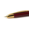 Pilot Vanishing Point fountain pen with red and gold finish, featuring a sleek design and fine nib for smooth writing.