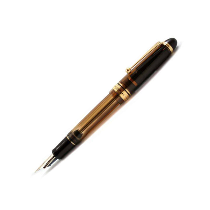 Pilot Custom 823 fountain pen with amber resin body and fine nib, showcasing a sleek, elegant writing instrument.
