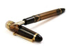 Pilot Custom 823 amber fountain pen with gold accents, featuring a fine nib and transparent amber body.