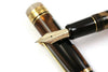 Pilot Custom 823 fountain pen in amber with fine nib, showcasing its elegant design and smooth ink flow.