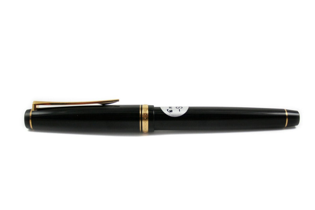 Pilot Falcon fountain pen in black and gold with a soft extra-fine nib, showcasing its elegant design and fine writing tip.