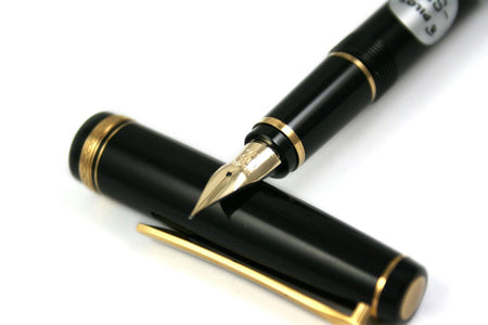 Pilot Falcon black and gold fountain pen with soft extra-fine nib, featuring sleek design and elegant finish.