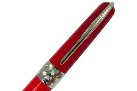 Pineider Avatar UR ballpoint pen in Devil Red with sleek design and gold accents, displayed on a white background.
