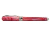 Pineider Avatar UR Fountain Pen in Angel Pink with gold accents, showcasing its elegant design and fine nib.