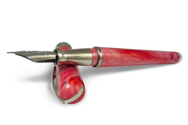 Pineider Avatar UR fountain pen in Angel Pink with an elegant design and fine nib, showcasing a luxurious writing instrument.