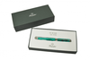 Pineider Avatar UR fountain pen in forest green with gold accents, featuring an elegant design and fine nib for smooth writing.