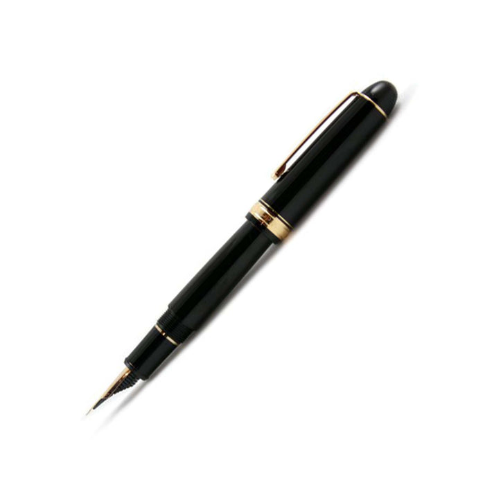 Platinum #3776 Century Black fountain pen with gold trim and fine nib, showcasing its sleek black resin body and elegant design.