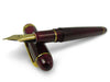 Platinum #3776 Century Bourgogne fountain pen with burgundy resin barrel and gold accents, showcasing an elegant writing instrument.