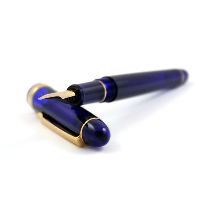 Platinum #3776 Century Fountain Pen in Chartres Blue with gold accents, showcasing its elegant design and fine nib.